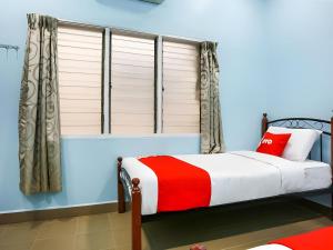 Postel nebo postele na pokoji v ubytování OYO 44094 Bangi Lanai Hotel