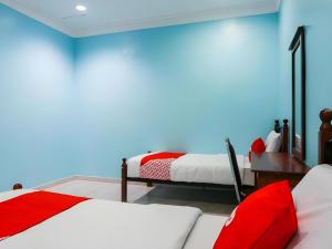 Postel nebo postele na pokoji v ubytování OYO 44094 Bangi Lanai Hotel