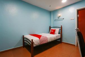 Postel nebo postele na pokoji v ubytování OYO 44094 Bangi Lanai Hotel