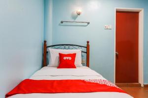 Postel nebo postele na pokoji v ubytování OYO 44094 Bangi Lanai Hotel