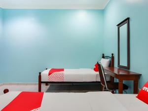 Postel nebo postele na pokoji v ubytování OYO 44094 Bangi Lanai Hotel