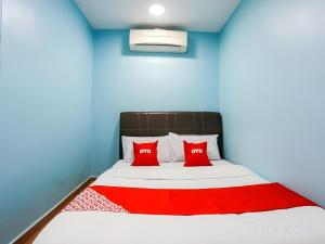 Postel nebo postele na pokoji v ubytování OYO 44094 Bangi Lanai Hotel