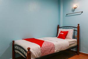 Postel nebo postele na pokoji v ubytování OYO 44094 Bangi Lanai Hotel