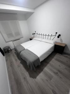 Postel nebo postele na pokoji v ubytování Hostal Mónaco