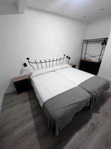 Postel nebo postele na pokoji v ubytování Hostal Mónaco