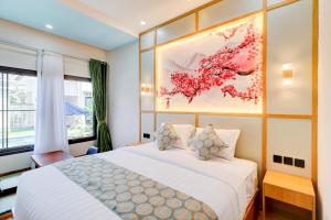 Postel nebo postele na pokoji v ubytování Collection O Samurai Hotel