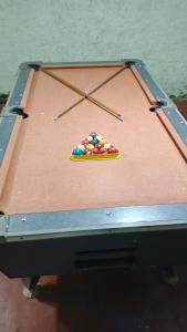 a pool table with a small pile of balls on it at Joa y Santi in Jardín América +14 photos