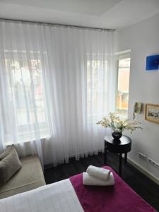Rúm í herbergi á Hotel Hecco
