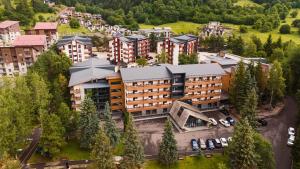 an aerial view of a building in a city at Bakuriani Inn in Bakuriani