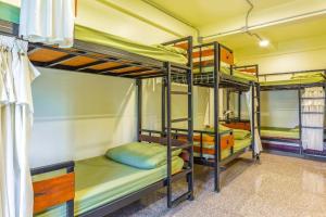 a group of bunk beds in a room at OYO 928 Leaf Hostel in Chiang Mai