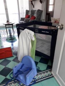 a room with two bunk beds and a blue chair at Plantation House Trinidad suite in Playa del Carmen +14 photos