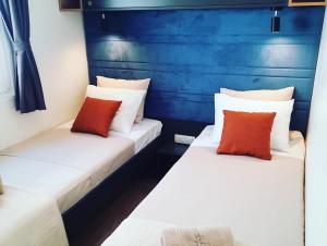 two beds sitting next to each other in a room at Horizon Blue Camp in Drage