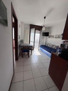 a living room with a couch and a table at AMA cityhouse in Novara +6 photos