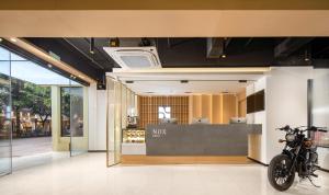 a store with a motorcycle parked in the lobby at NOX Hotel in Chengdu