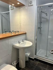 a bathroom with a sink and a shower at Laurel Bank Hotel in Markinch +31 photos