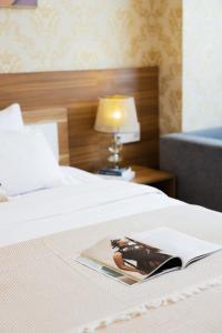 Postel nebo postele na pokoji v ubytování TTR Vincent Hotel