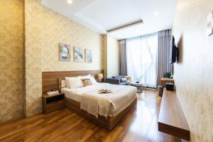 Postel nebo postele na pokoji v ubytování TTR Vincent Hotel