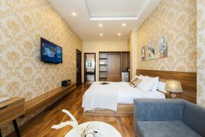 Postel nebo postele na pokoji v ubytování TTR Vincent Hotel