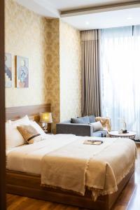 Postel nebo postele na pokoji v ubytování TTR Vincent Hotel