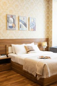 Postel nebo postele na pokoji v ubytování TTR Vincent Hotel