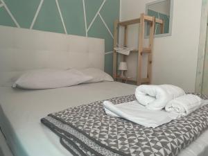 Postel nebo postele na pokoji v ubytování Dama HostelBB