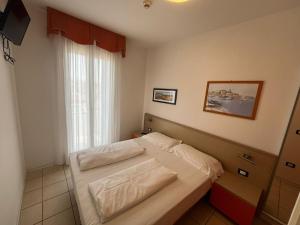 Posteľ alebo postele v izbe v ubytovaní Villaggio Hemingway - Family Aparthotel