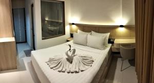 En eller flere senge i et værelse på The Hita Uluwatu