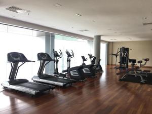 a gym with a bunch of tread machines in a room at Azure ParadigmPJ LeMeridienHotel in Petaling Jaya