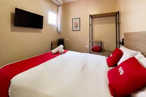 Postel nebo postele na pokoji v ubytování OYO Hotel Itarantim, São Paulo
