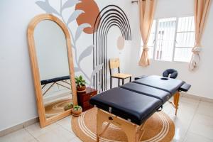 a dressing room with a mirror and a dressing table at YO ki GA li in Kigali