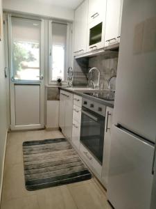 Kuchyň nebo kuchyňský kout v ubytování Apartman SIMONA