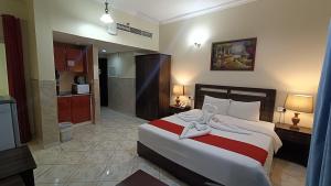 Postel nebo postele na pokoji v ubytování Ruwi Beach Hotel Apartments - MAHA HOSPITALITY GROUP + 37 fotografií