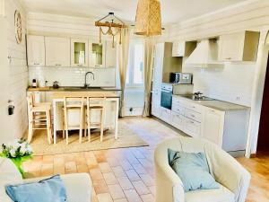a kitchen with a couch and a table in a room at Baia dell Alba in Termoli