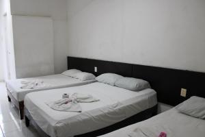 Postel nebo postele na pokoji v ubytování OYO Hotel Colibri