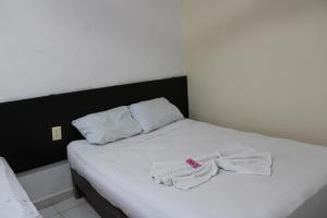 Postel nebo postele na pokoji v ubytování OYO Hotel Colibri