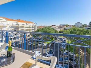 a balcony with a view of a parking lot at Apartment Parc de Pontaillac-3 by Interhome in Pontaillac