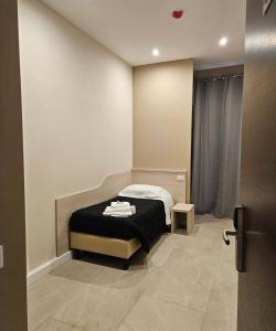 Postel nebo postele na pokoji v ubytování Hotel Mosaic Central Rome