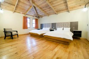 Capital O Collection O Casona De Minas Mineral del Monte客房内的一张或多张床位