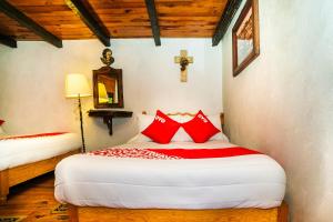 Postel nebo postele na pokoji v ubytování OYO Hotel El Mineral, Tlalpujahua