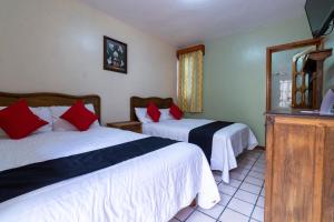 Postel nebo postele na pokoji v ubytování Capital O Hospedaje Los Angeles San Cristobal De Las Casas