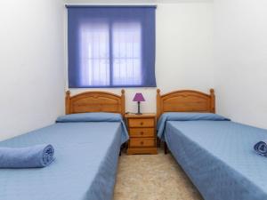 Postel nebo postele na pokoji v ubytování Apartment Oroblanc by Interhome