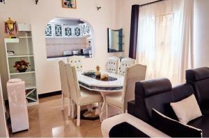 a dining room with a table and chairs at Dema home in Arusha