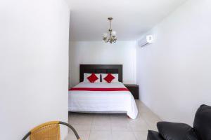 Postel nebo postele na pokoji v ubytování OYO Hotel Rio