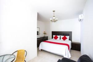 Postel nebo postele na pokoji v ubytování OYO Hotel Rio