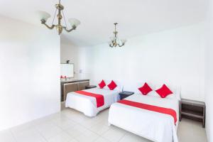 Postel nebo postele na pokoji v ubytování OYO Hotel Rio
