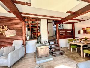 a living room with a couch and a fireplace at Holiday Home Eric by Interhome in Frankenau