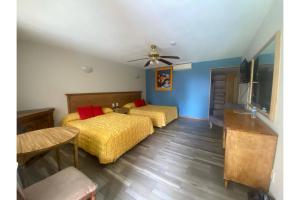 Postel nebo postele na pokoji v ubytování Capital O Gran Hotel Campestre