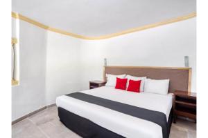 Postel nebo postele na pokoji v ubytování Capital O Gran Hotel Campestre + 37 fotografií