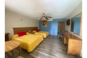 Postel nebo postele na pokoji v ubytování Capital O Gran Hotel Campestre