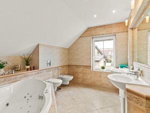 a bathroom with two sinks and two toilets at Villa Garden & Terrace Villa by Interhome in Prague